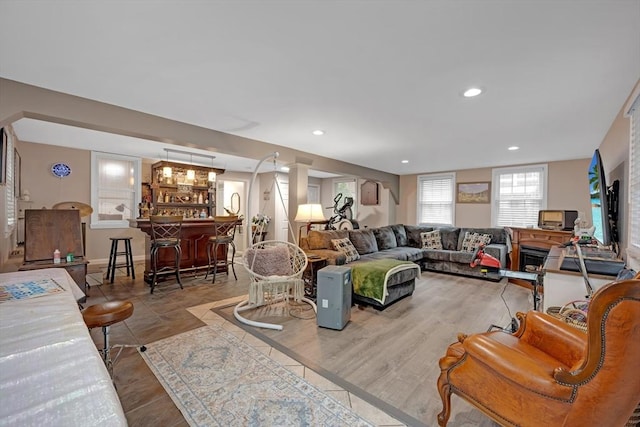 living room with bar and recessed lighting