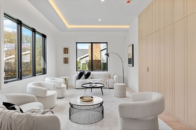 living room featuring light wood-type flooring and plenty of natural light