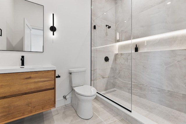 936 Central Ave, Needham, MA 02492 - full bathroom featuring toilet, vanity, a marble finish shower, baseboards, and marble finish floors