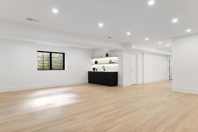 936 Central Ave, Needham, MA 02492 - unfurnished living room with wet bar, recessed lighting, light wood finished floors, and baseboards