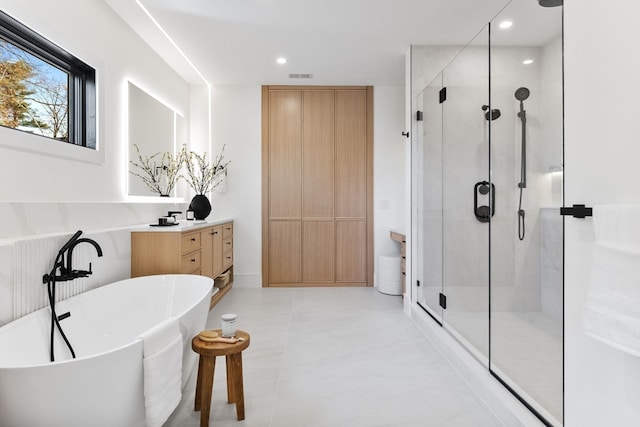 bathroom with vanity and plus walk in shower