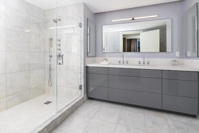 full bath with vanity and a stall shower