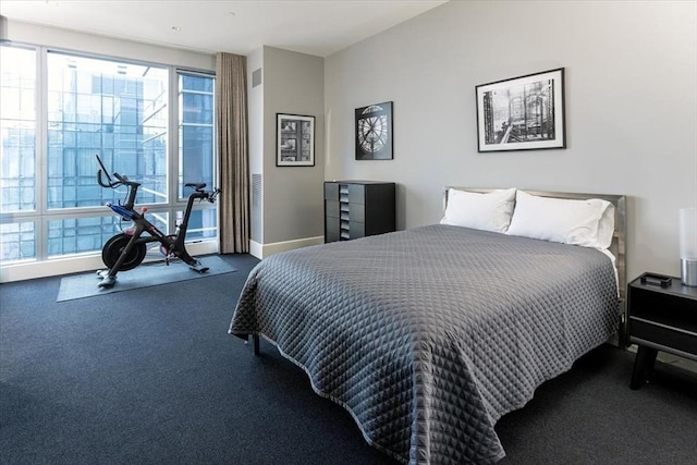 carpeted bedroom with baseboards