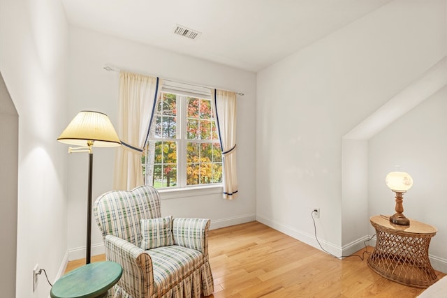 living area with light hardwood / wood-style flooring