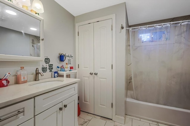 bathroom with shower / bath combo and vanity