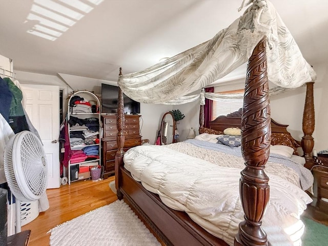 bedroom with wood finished floors