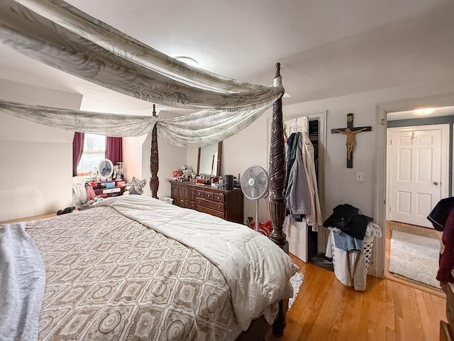 bedroom with a closet and wood finished floors