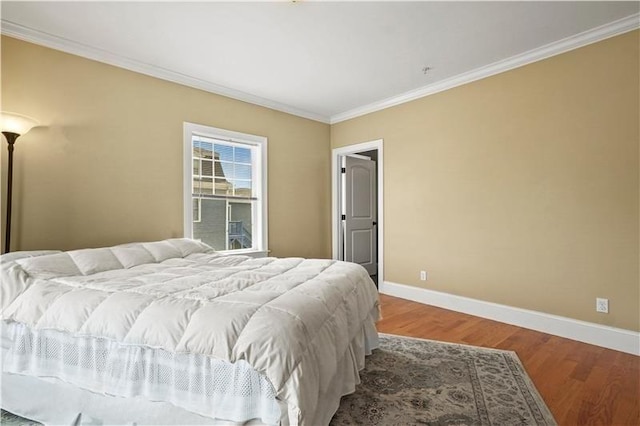 75 Pine St Unit 21, Waltham, MA 02453 - bedroom with baseboards, ornamental molding, and wood finished floors