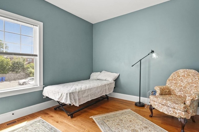 75 Pine St Unit 21, Waltham, MA 02453 - bedroom featuring baseboards and wood finished floors