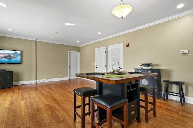 75 Pine St Unit 21, Waltham, MA 02453 - dining room featuring wood finished floors, ornamental molding, baseboards, and recessed lighting