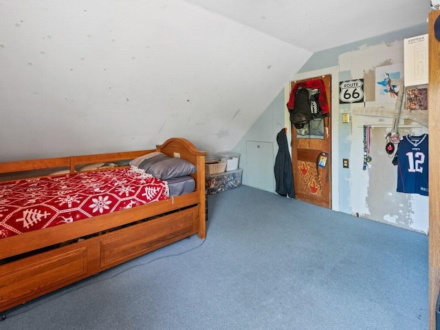 carpeted bedroom with vaulted ceiling