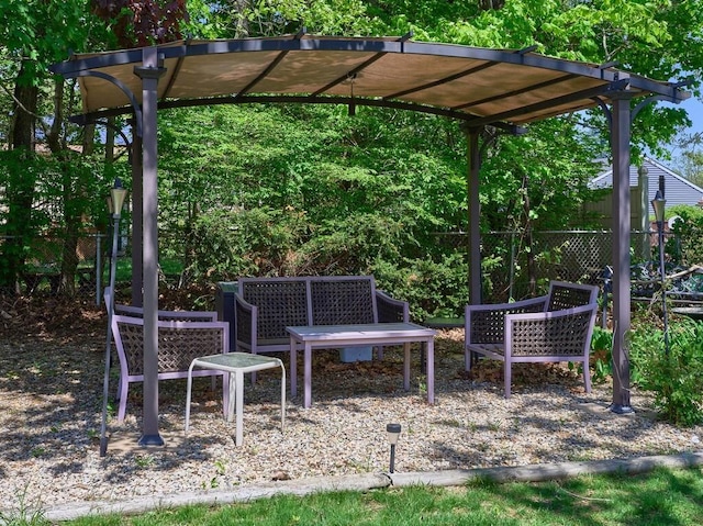 view of patio featuring fence and a pergola