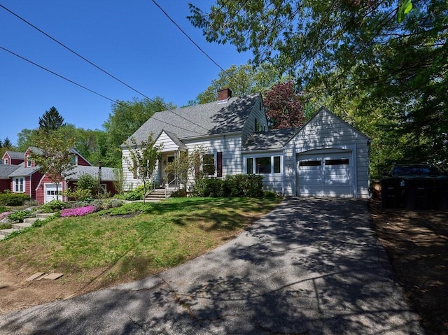 cape cod-style house with a garage, asphalt driveway, a front lawn, and a chimney