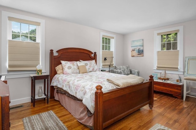 46 Pine, Falmouth, MA 02556 - bedroom featuring wood finished floors, multiple windows, and baseboards