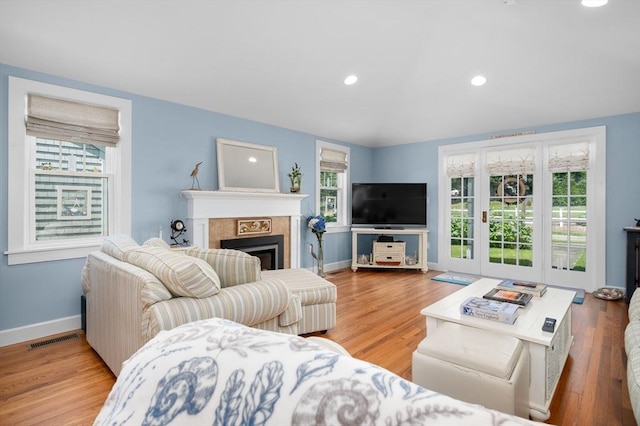 46 Pine, Falmouth, MA 02556 - living room with a fireplace, baseboards, wood finished floors, and recessed lighting