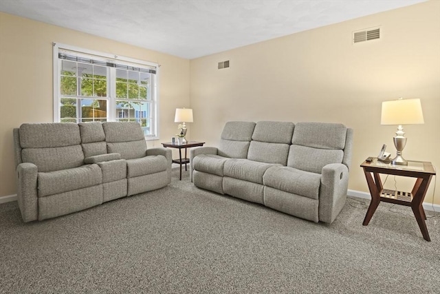 carpeted living room with baseboards