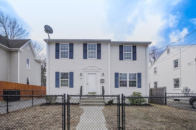 colonial inspired home with a fenced front yard