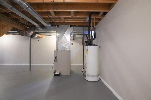 unfinished basement featuring heating unit, baseboards, and water heater