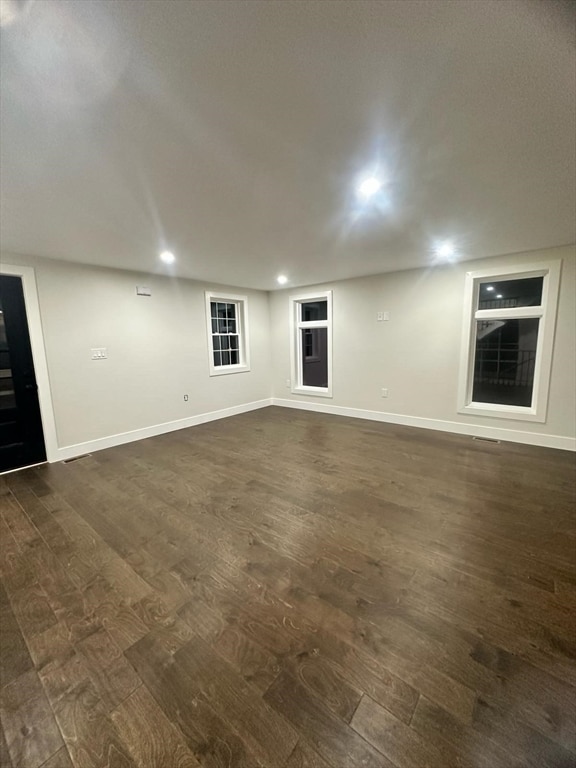 interior space with dark hardwood / wood-style flooring