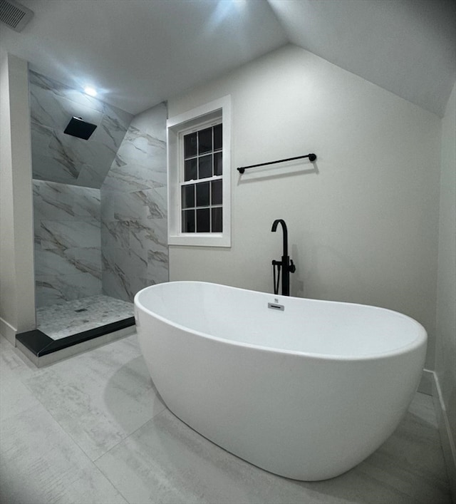 bathroom with vaulted ceiling and shower with separate bathtub