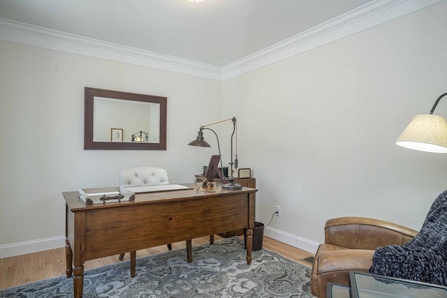 office area featuring hardwood / wood-style floors and ornamental molding