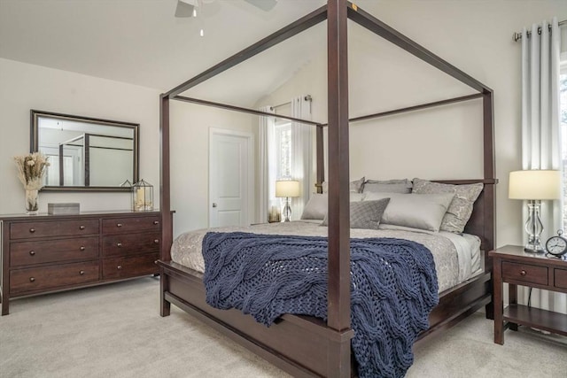 carpeted bedroom featuring ceiling fan and lofted ceiling