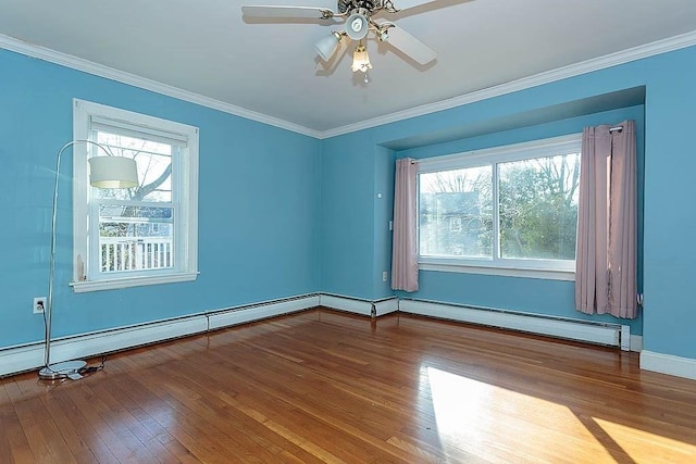 spare room with hardwood / wood-style floors, a baseboard radiator, ornamental molding, and ceiling fan