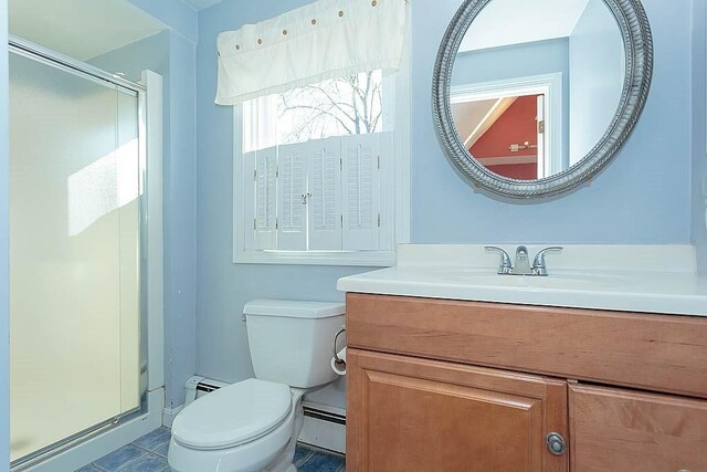 full bathroom featuring vanity, a baseboard radiator, a stall shower, toilet, and baseboard heating