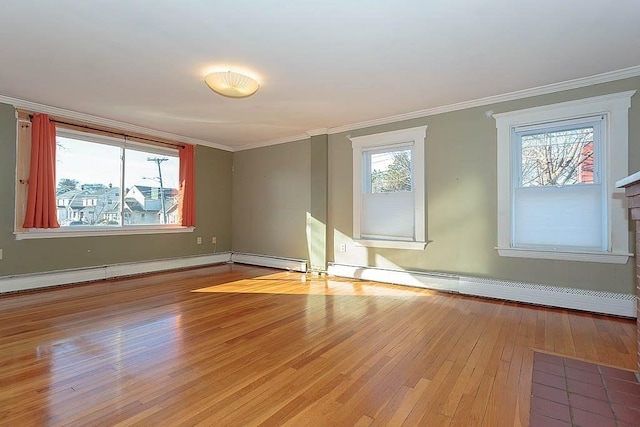 unfurnished room with a baseboard heating unit, wood-type flooring, and ornamental molding