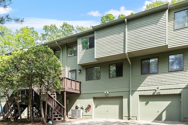 263 Meeting House Path Unit 263, Ashland, MA 01721 - view of building exterior featuring a garage, stairs, and driveway
