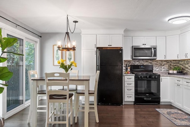 263 Meeting House Path Unit 263, Ashland, MA 01721 - kitchen with black appliances, decorative backsplash, dark wood-type flooring, a chandelier, and white cabinets