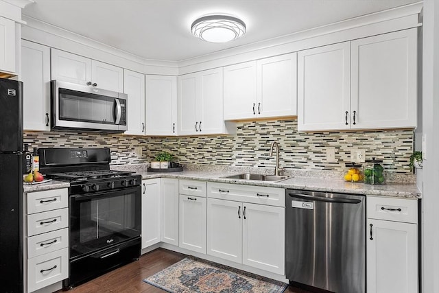 263 Meeting House Path Unit 263, Ashland, MA 01721 - kitchen with black appliances, a sink, white cabinets, dark wood-type flooring, and tasteful backsplash