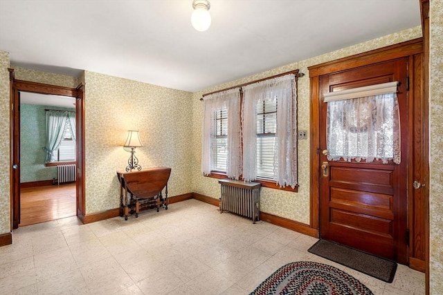 foyer with a wealth of natural light and radiator