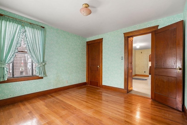 unfurnished bedroom featuring hardwood / wood-style floors