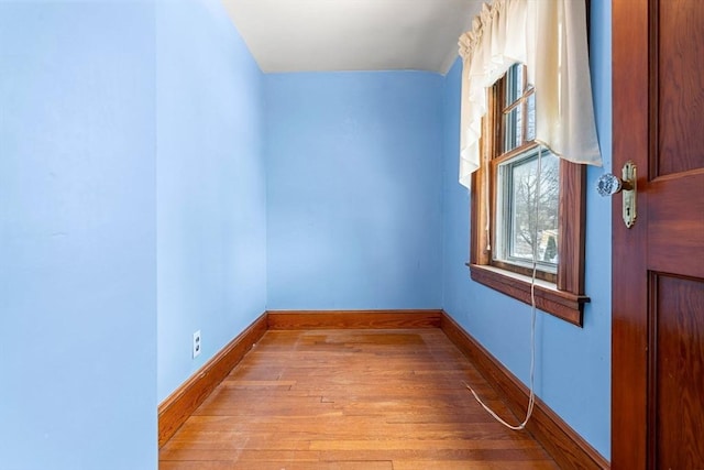 unfurnished room with light wood-type flooring