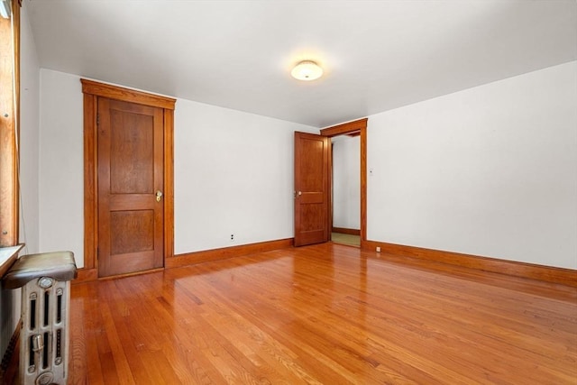 unfurnished room featuring light hardwood / wood-style floors