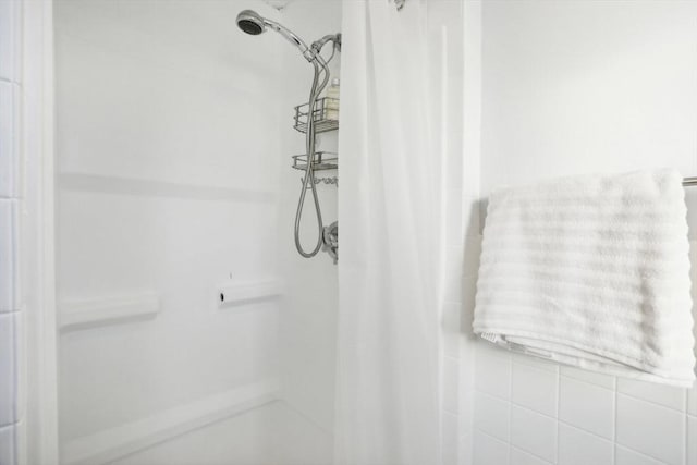 bathroom with a shower with shower curtain