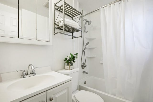 full bathroom featuring vanity, toilet, and shower / bath combo with shower curtain