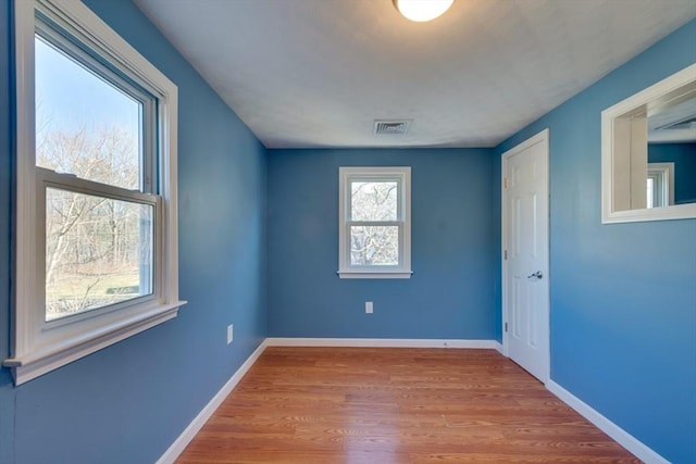 spare room featuring light wood-type flooring