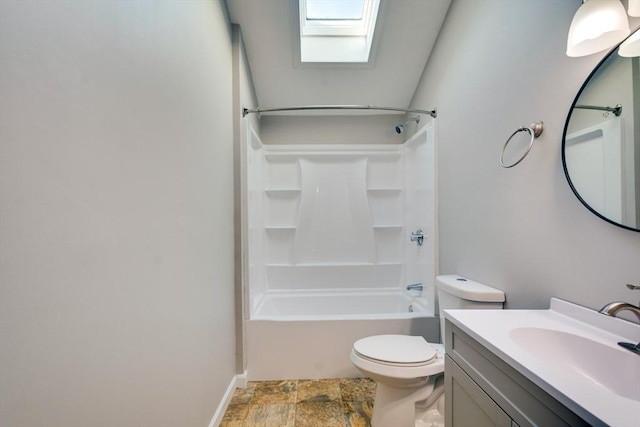 full bathroom featuring vanity, toilet, washtub / shower combination, and a skylight