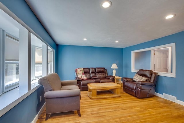 living room with light hardwood / wood-style flooring