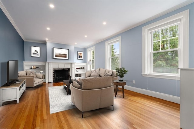 132 Sewall St Unit C, Brookline, MA 02446 - living area with ornamental molding, light wood-style flooring, a fireplace, baseboards, and recessed lighting