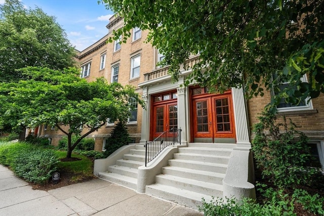132 Sewall St Unit C, Brookline, MA 02446 - view of exterior entry featuring french doors and brick siding