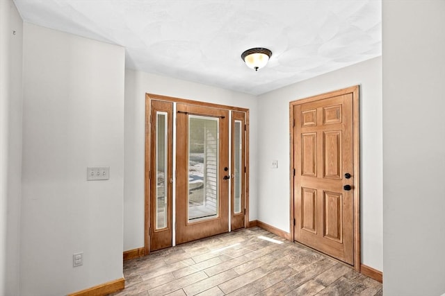 entryway with light hardwood / wood-style floors