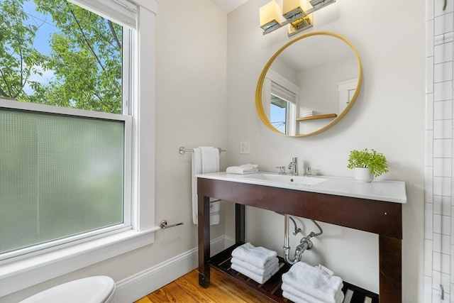 50 Alpine St Unit 2, Somerville, MA 02144 - bathroom featuring wood finished floors, baseboards, and toilet