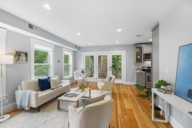 50 Alpine St Unit 2, Somerville, MA 02144 - living area featuring recessed lighting, plenty of natural light, light wood-type flooring, and baseboards