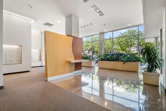 1010 Memorial Dr Unit 3F, Cambridge, MA 02138 - common area featuring floor to ceiling windows and a towering ceiling
