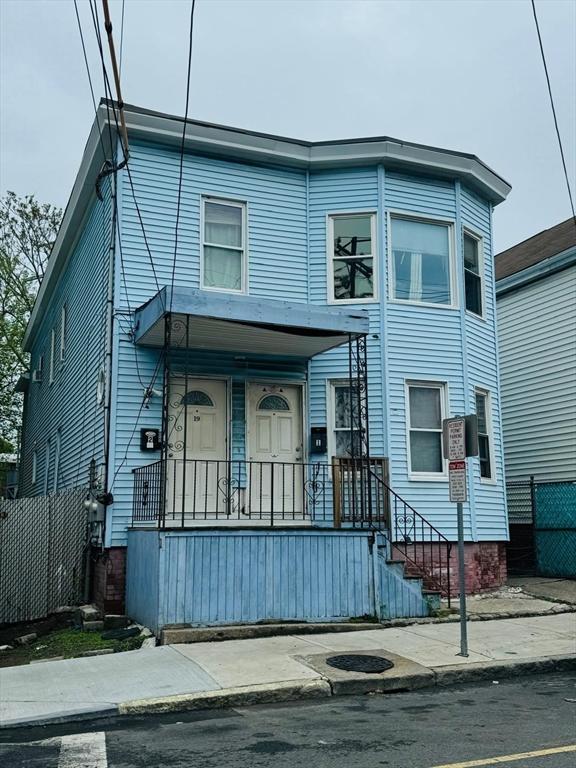 19 6th St, Chelsea, MA 02150 - view of front facade featuring a porch and fence