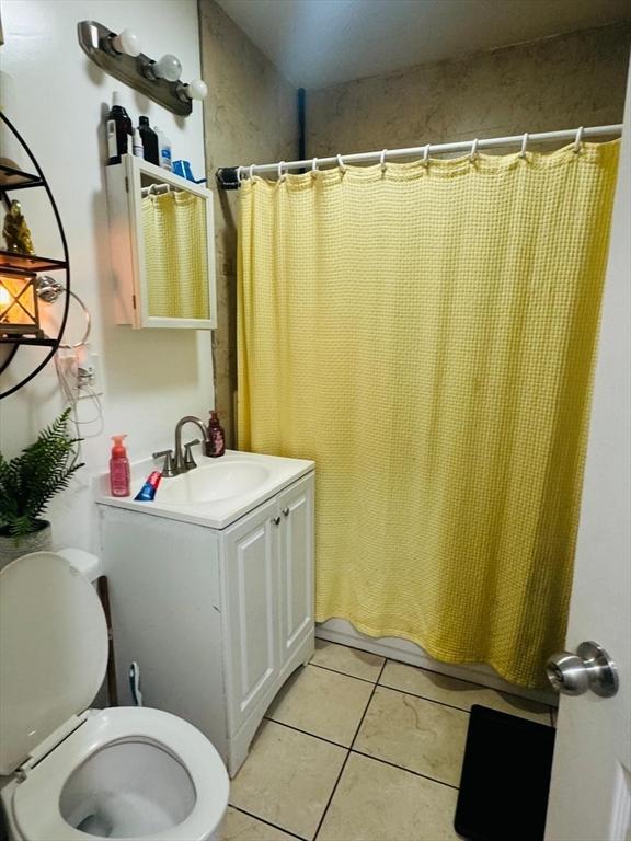 19 6th St, Chelsea, MA 02150 - bathroom featuring toilet, tile patterned flooring, and vanity