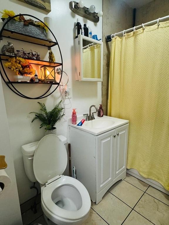 19 6th St, Chelsea, MA 02150 - full bath with tile patterned flooring, toilet, a shower with curtain, and vanity